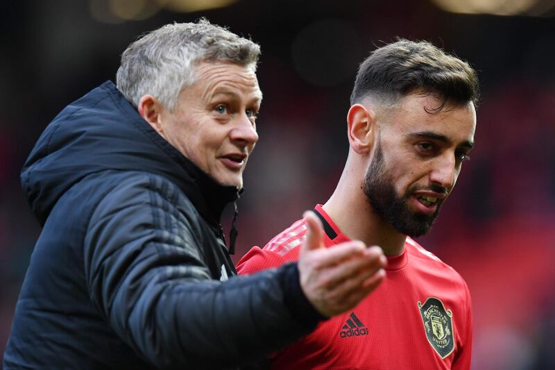 Manchester United's Portuguese midfielder Bruno Fernandes (R) and Manchester United's Norwegian manager Ole Gunnar Solskjaer (L) react as they leaves the pitch at the end of the English Premier League football match between Manchester United and Watford at Old Trafford in Manchester, north west England, on February 23, 2020. RESTRICTED TO EDITORIAL USE. No use with unauthorized audio, video, data, fixture lists, club/league logos or 'live' services. Online in-match use limited to 120 images. An additional 40 images may be used in extra time. No video emulation. Social media in-match use limited to 120 images. An additional 40 images may be used in extra time. No use in betting publications, games or single club/league/player publications.
 / AFP / Paul ELLIS / RESTRICTED TO EDITORIAL USE. No use with unauthorized audio, video, data, fixture lists, club/league logos or 'live' services. Online in-match use limited to 120 images. An additional 40 images may be used in extra time. No video emulation. Social media in-match use limited to 120 images. An additional 40 images may be used in extra time. No use in betting publications, games or single club/league/player publications.
