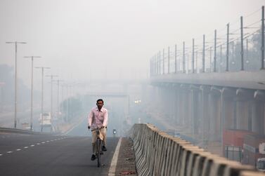 A cyclist on a road shrouded in smog in Delhi, India, the day after Diwali. Toxic air is estimated to kill more than one million Indians each year. Ruhani Kaur / Bloomberg