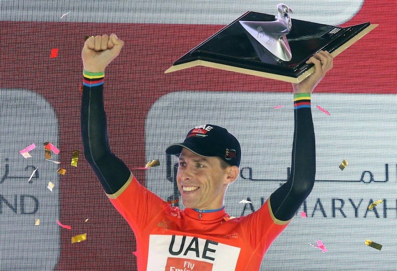 Portuguese rider Rui Costa of UAE Team Emirates celebrates on the podium after winning the Abu Dhabi Tour cycling red jersey. Matteo Bazzi / EPA