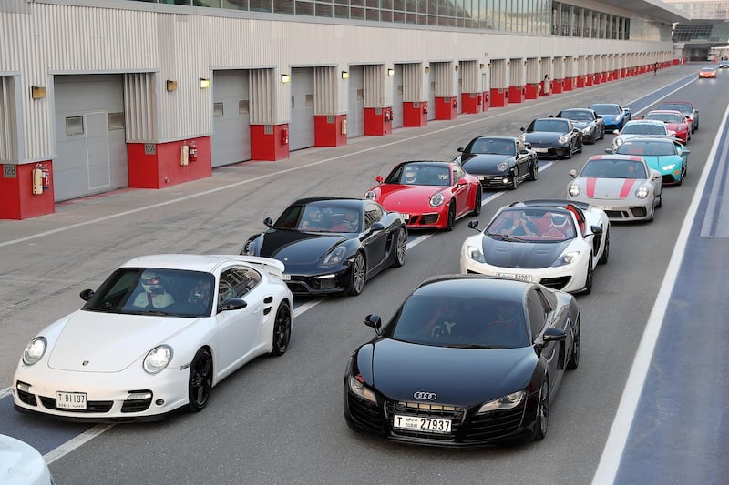 DUBAI, UNITED ARAB EMIRATES, August 31 – 2018 :- Members and Guests of the Ninth Degree supercars club lined up to drive their cars during the Ninth Degree supercars club meet held at Dubai Autodrome in Dubai. ( Pawan Singh / The National )  For Motoring. Story by Adam Workman