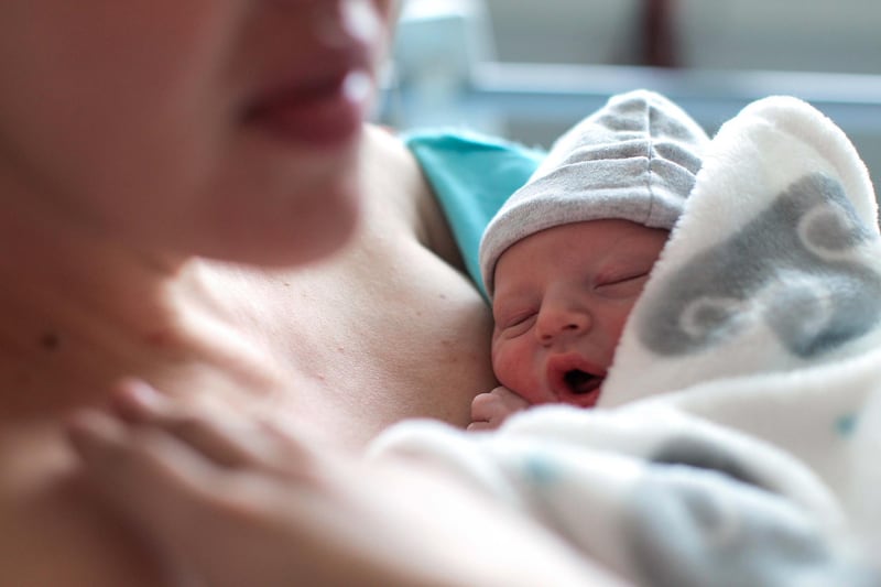 a Newborn baby boy breastfeeding for the first time in hospital, directly after a caesarean section. Getty Images