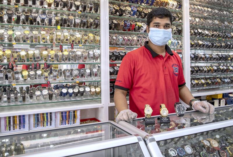 Abu Dhabi, United Arab Emirates, April 23, 2020.  Abdul Aziz, a watch salesman at the City Night Gift shop, Mussafah 32 area during the Coronavirus pandemic.
Victor Besa / The National
Section:  NA
For: stock images and standalone