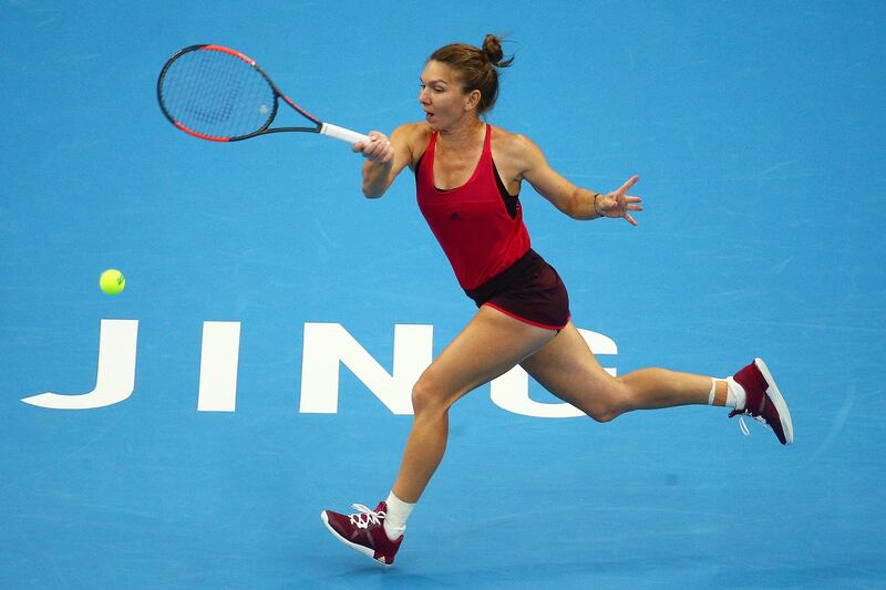 epa06243689 Simona Halep of Romania in action against Maria Sharapova of Russia during their women's third round match of the China Open tennis tournament at the National Tennis Center in Beijing, China, 04 October 2017.  EPA/WU HONG