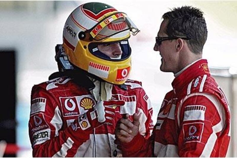 Ferrari test driver Luca Badoer, left, will replace Michael Schumacher, right, for the Valencia race, 10 years after his last race in F1 when he drove for Minardi and retired early from the Japanese Grand Prix. Schumacher cancelled his plans to return to F1 because of fitness concerns.