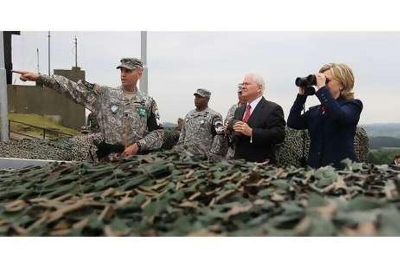 Hillary Clinton, the US secretary of state, and Robert Gates, the defence secretary, at an observation post yesterday for the demilitarised zone between North and South Korea.