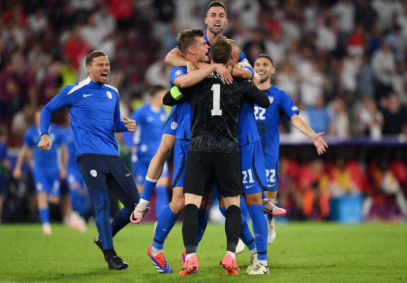 Jan Oblak of Slovenia celebrates with teammates after the final whistle. Getty Images