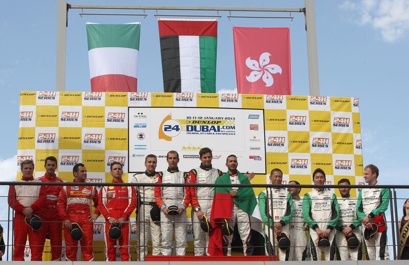 Dubai, United Arab Emirates, Jan 12 2013, 24h Dunlop - Team Abu Dhabi Black Falcon 1 Drivers stand on the awards podium before receiving their trophies, this will be the second win for Team Abu Dhabi .  Mike Young / The National  