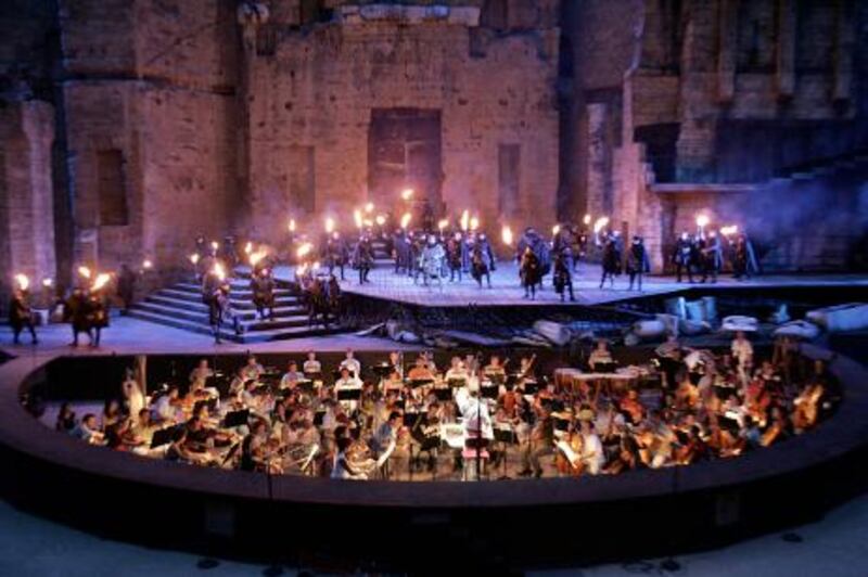 The Opera chorus of Nice performs "Lucia di Lammermoor", a three-act opera by Donizetti directed by Paul-Emile Fourny and Marco Guidarini, 26 July 2006 at the Antic theatre of Orange during the "Orange Choregies" festival.   AFP PHOTO ANNE-CHRISTINE POUJOULAT