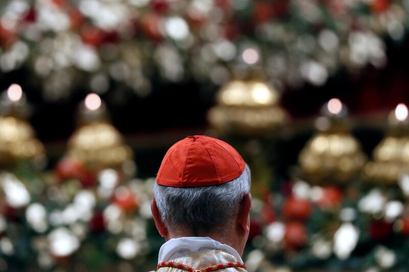 A cardinal attends the Christmas Eve mass led by Pope Francis in St Peter's Basilica at the Vatican. Reuters