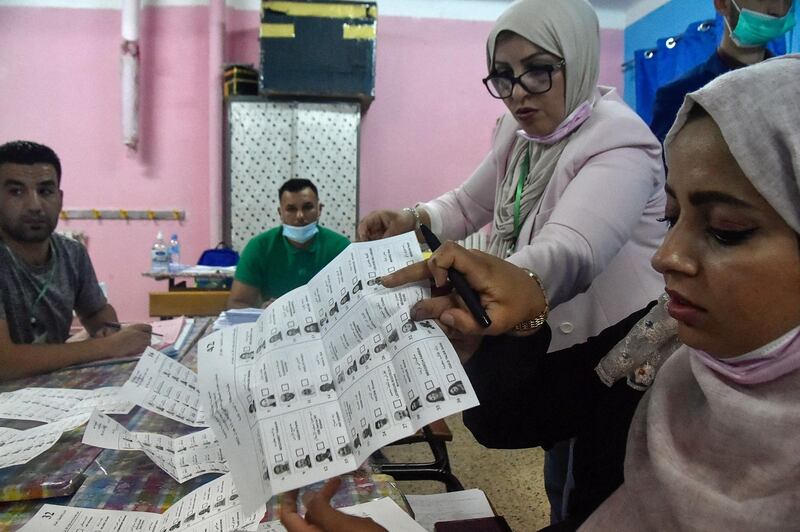 Algerian elections staff count ballots for parliamentary elections at a polling station in Bouchaoui, on the western outskirts of the capital Algiers. AFP