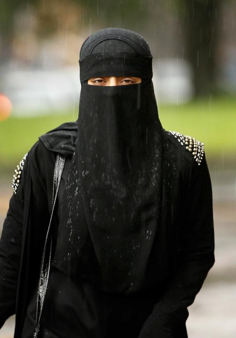 A woman wears a full face Niqab on the streets of Blackburn, England. Christopher Furlong / Getty Images