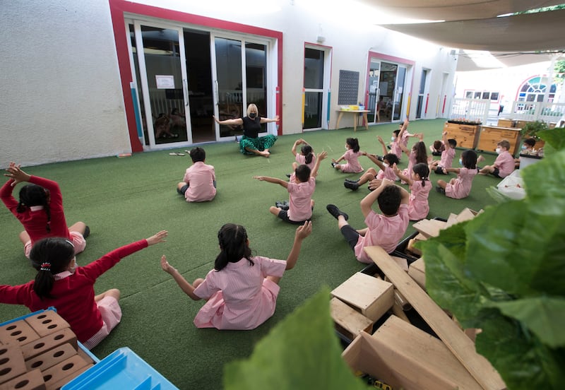 Pupils stretch with their teacher at the school in Dubai.