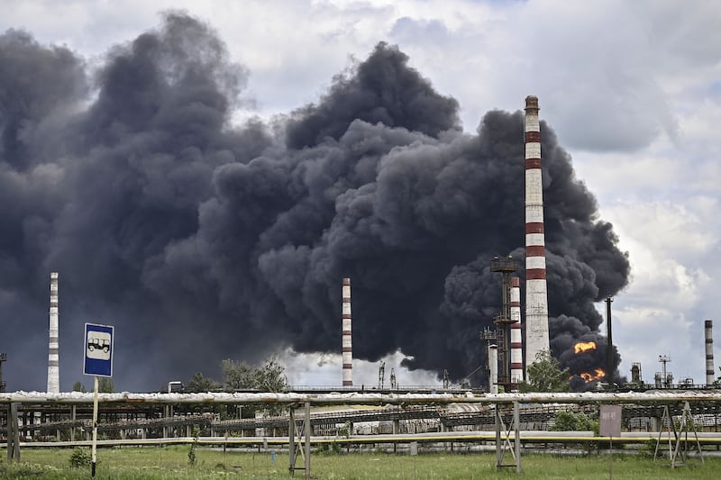 Smoke billows from an oil refinery after an attack outside the city of Lysychansk, in the eastern Ukrainian region of Donbas. AFP