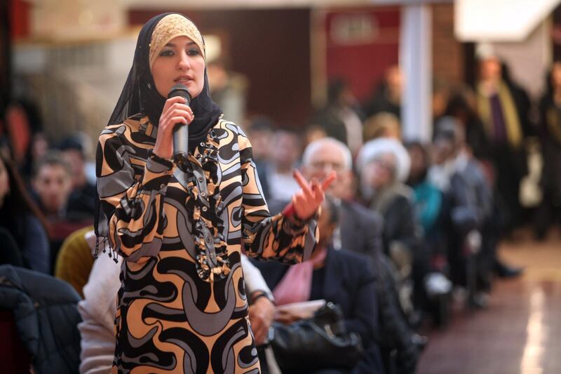 Linda Sarsour, director of the Arab American Assoc. of New York, asks a  question during a meeting of the Muslim and Arab community  held by the Arab American Institute in Sunset Park Brooklyn.
Photo by Michael Falco
