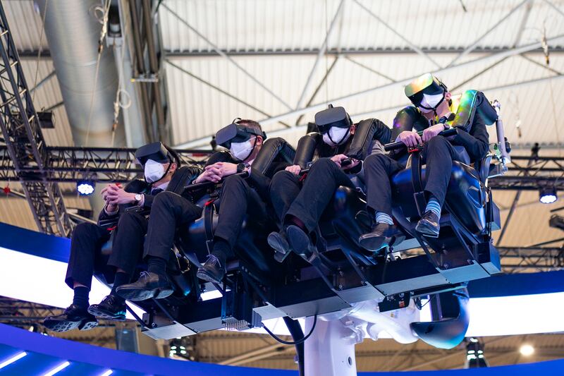 Visitors use an SK Telecom flight simulator. AP Photo