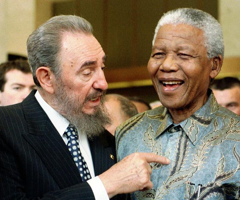 Cuban leader Fidel Castro, left, shares a laugh with South Africa President Nelson Mandela at a meeting of the World Trade Organisation in Geneva, Switzerland. Patrick Aviolat / Keystone / AP Photo