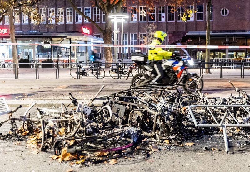 Burnt bikes after a protest against the partial lockdown and against the 2G government policy in Rotterdam. AFP