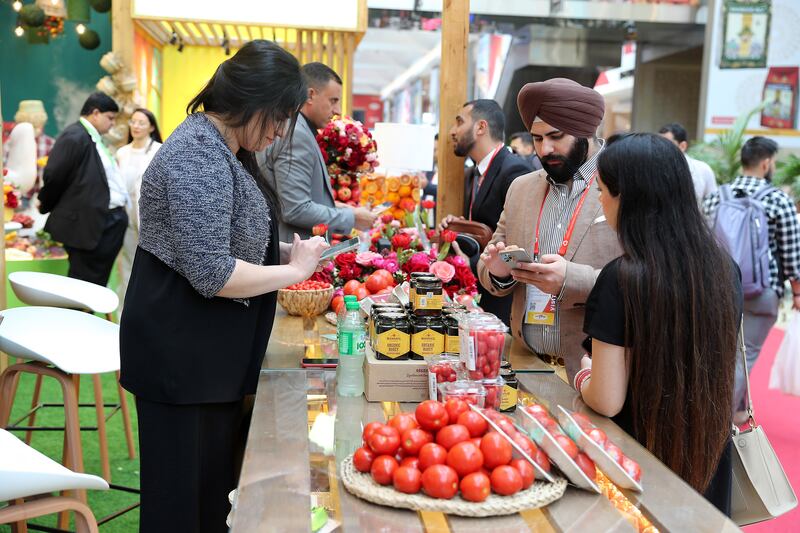 Visitors at a stand at the Gulfood exhibition.