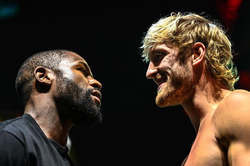 Floyd Mayweather and Logan Paul face off. AFP