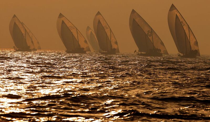 Sailors participate in the annual long-distance dhow sailing race, known as al-Gaffal, near Sir Abu Nuair island towards Dubai, on June 4, 2021.  / AFP / Karim SAHIB
