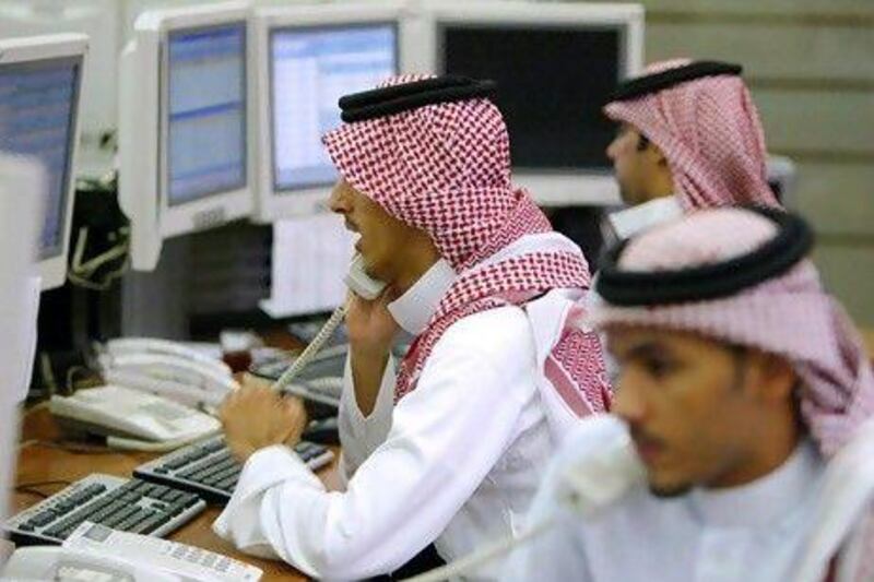 Saudi Arabia's stocks lose around (US$7.5 billion) yesterday as the kingdom's bourse reacts to the US losing its top-tier credit rating from Standard & Poor's. AFP PHOTO/PATRICK BAZ