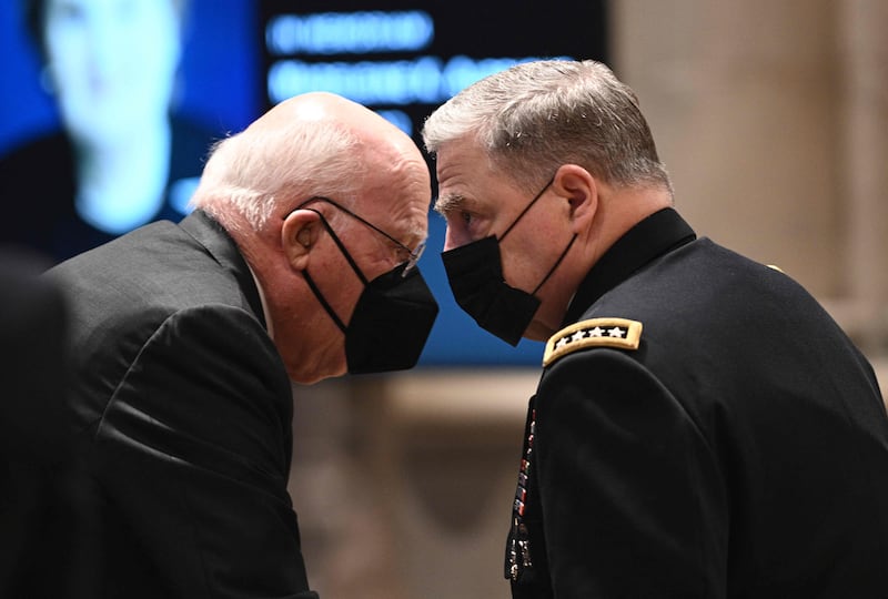 Gen Mark Milley, Chairman of the Joint Chiefs of Staff, speaks with Patrick Leahy, a US senator, as they arrive for the funeral service. AFP