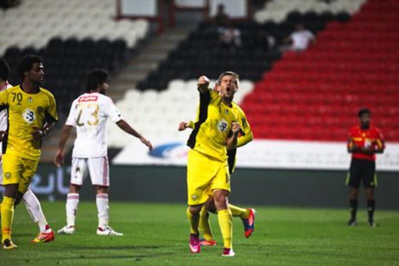 Al Wasl's Emiliano Alfaro celebrates scoring the winning penalty against Al Jazira.