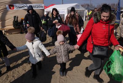 Women and children from Ukraine arrive in Poland at the Budomierz border crossing on Sunday. Getty Images