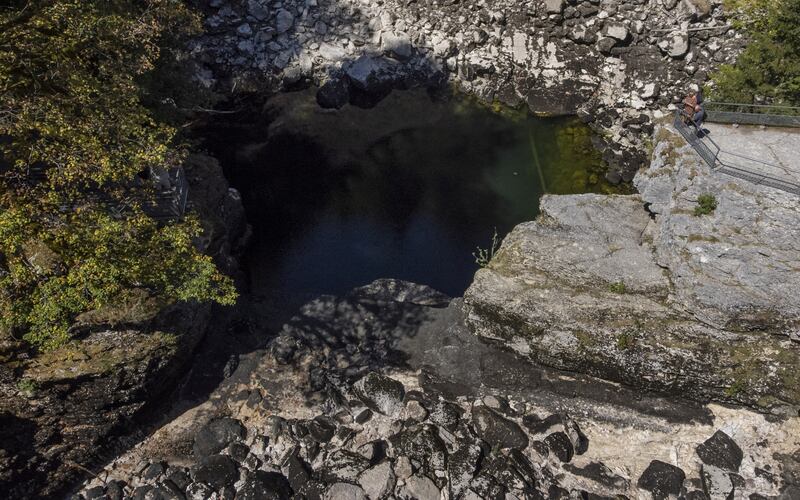 People look at the dried-up Saut du Doubs waterfall in Les Brenets, Switzerland. Reuters