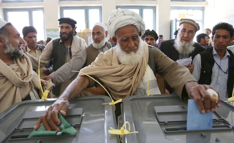 An Afghan man casts his vote at a polling station in Jalalabad, east of Kabul on April 5. Rahmat Gul / AP 