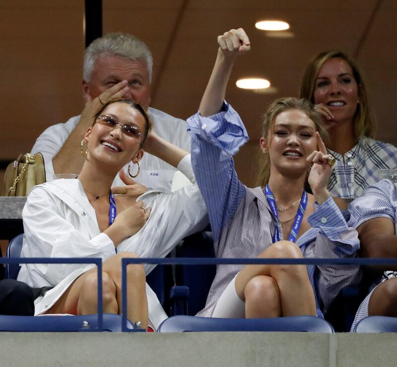 epa06997536 US models Bella and her sister Gigi Hadid (R) cheer during the Serena Williams of United States vs Karolina Pliskova of the Czech Republic match during the ninth day of the US Open Tennis Championships the USTA National Tennis Center in Flushing Meadows, New York, USA, 04 September 2018. The US Open runs from 27 August through 09 September.  EPA-EFE/JASON SZENES