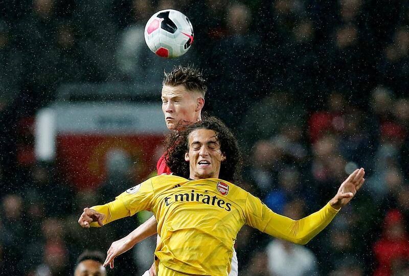 Soccer Football - Premier League - Manchester United v Arsenal - Old Trafford, Manchester, Britain - September 30, 2019 Arsenal's Matteo Guendouzi in action Manchester United's Scott McTominay REUTERS/Andrew Yates EDITORIAL USE ONLY. No use with unauthorized audio, video, data, fixture lists, club/league logos or "live" services. Online in-match use limited to 75 images, no video emulation. No use in betting, games or single club/league/player publications. Please contact your account representative for further details.