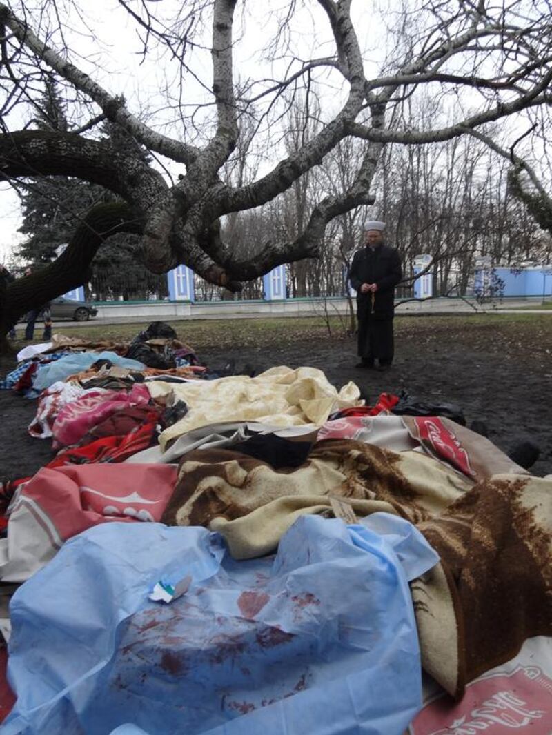 Mufti Said Ismagilov prays over the bodies of civilians killed in Kiev’s Maidan square, Ukraine, on February 20, 2014. Courtesy Ihor Karpishen.