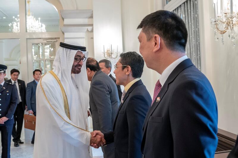 SINGAPORE, SINGAPORE - February 28, 2019: HH Sheikh Mohamed bin Zayed Al Nahyan, Crown Prince of Abu Dhabi and Deputy Supreme Commander of the UAE Armed Forces (2nd L) greets a member of the Singaporean delegation during a reception, at the Istana presidential palace.
( Mohamed Al Hammadi / Ministry of Presidential Affairs )
---