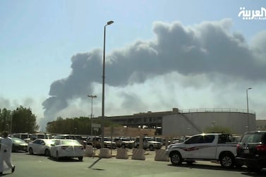 Smoke from a fire at the Abqaiq oil processing facility fills the skyline, in Buqyaq, Saudi Arabia. Al-Arabiya via AP