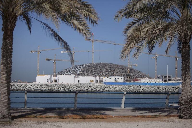 The roof of the Louvre Abu Dhabi reached an important milestone last week when the 7,000-tonne canopy was taken off its temporary supports and lowered on to four permanent concrete towers. Silvia Razgova / The National