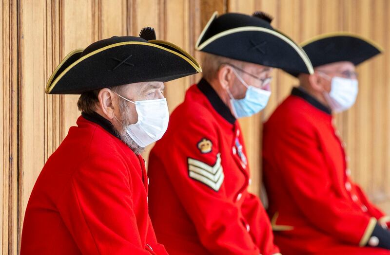 Chelsea Pensioners wear protective face masks during a visit by Camilla, Duchess Of Cornwall, to the Royal Hospital Chelsea on July 15 London, England. WPA Pool/Getty Images