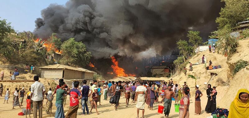 Smoke rises following a fire at the Rohingya refugee camp in Balukhali, southern Bangladesh. AP Photo