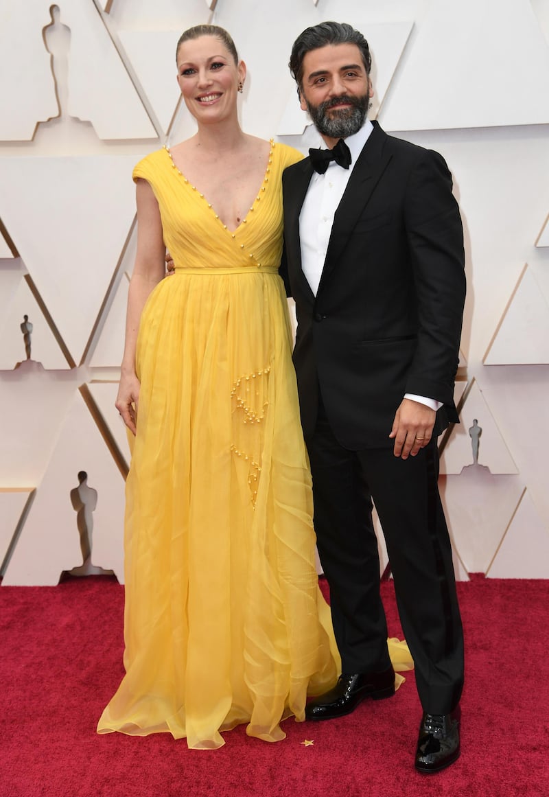 Elvira Lind and Oscar Isaac arrive at the Oscars on Sunday, February 9, 2020, at the Dolby Theatre in Los Angeles. AP