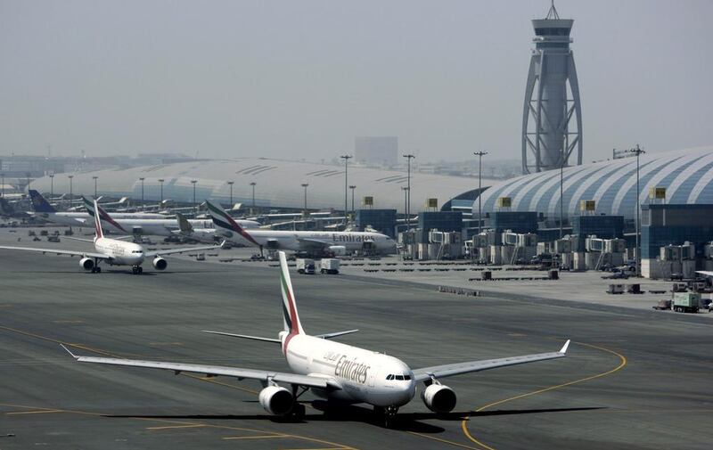 An Emirates airline passenger jet taxis on the tarmac at Dubai International airport in Dubai. Kamran Jebreili / AP Photo