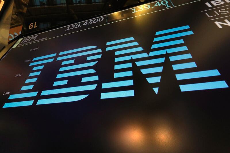 FILE - In this March 18, 2019, photo the logo for IBM appears above a trading post on the floor of the New York Stock Exchange. IBM is offering up its speedy supercomputer to help combat the new coronavirus. The technology company said Sunday, March 22, 2020, that it is working with the White House and the U.S. Department of Energy to make its computing power more accessible to researchers tackling the coronavirus. (AP Photo/Richard Drew, File)