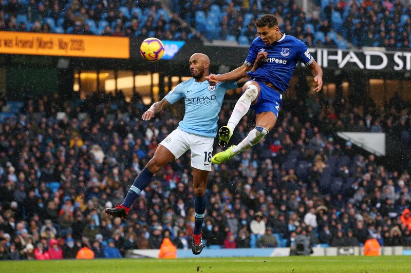 Dominic Calvert-Lewin of Everton scores his team's first goal as he is challenged by Fabian Delph of Manchester City. Getty Images