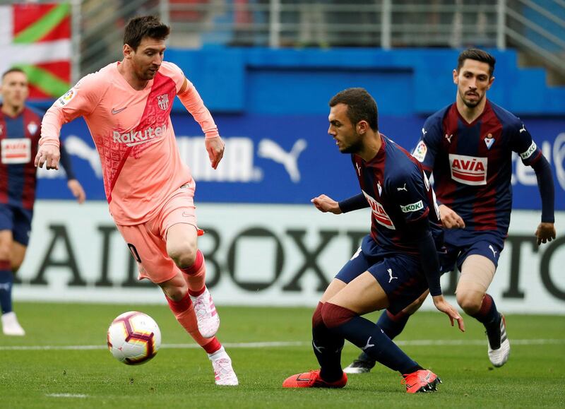 Eibar's Joan Jordan, right, in action against Messi. EPA