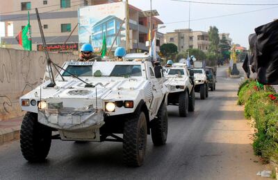 Soldiers of the United Nations Interim Forces in Lebanon (UNIFIL) patrol a road in the southern Lebanese village of Kfar Kila along the border with Israel on August 29, 2019. The Lebanese army opened fire on Israeli drones in south Lebanon Wednesday in a rare incident as tensions mount between the neighbours. This came days after Lebanese Shiite movement Hezbollah, with which Israel has fought several wars, accused the Jewish state of carrying out a drone attack Sunday on its Beirut stronghold. / AFP / Mahmoud ZAYYAT
