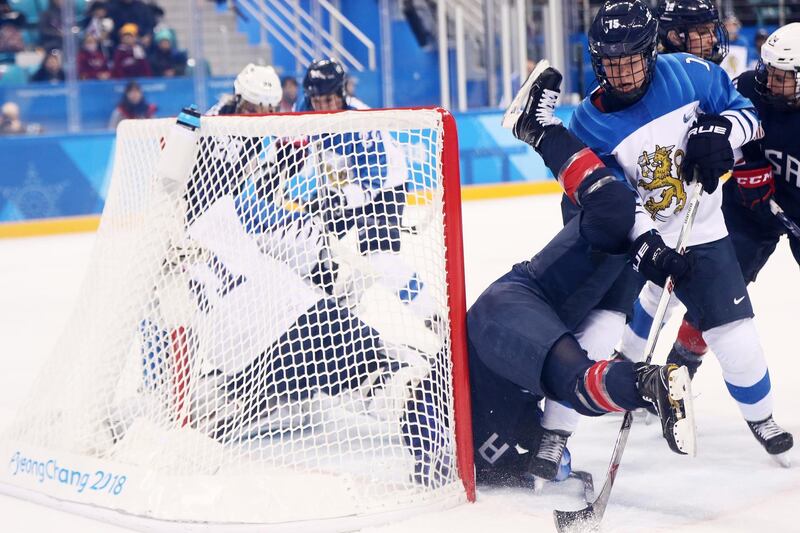 Hannah Brandt, number 20 of the United States is upended by Minnamari Tuominen, number 15 of Finland, during the Ice Hockey Women Play-offs Semifinals on day 10 of the PyeongChang 2018 Winter Olympic Games at Gangneung Hockey Centre. Jamie Squire / Getty Images