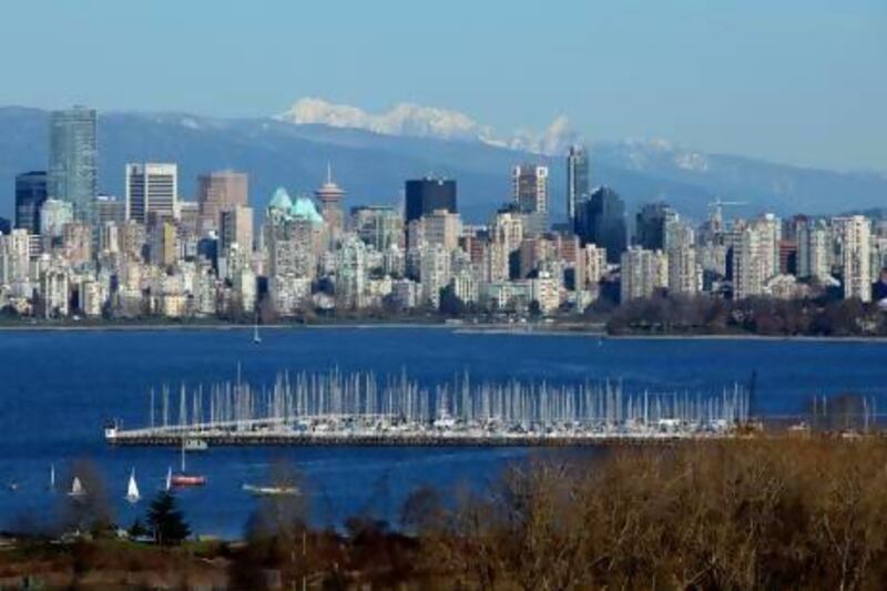 A view of Vancouver's mountain-backed skyline, seen from across English Bay. Bayne Stanley/First Light/Corbis