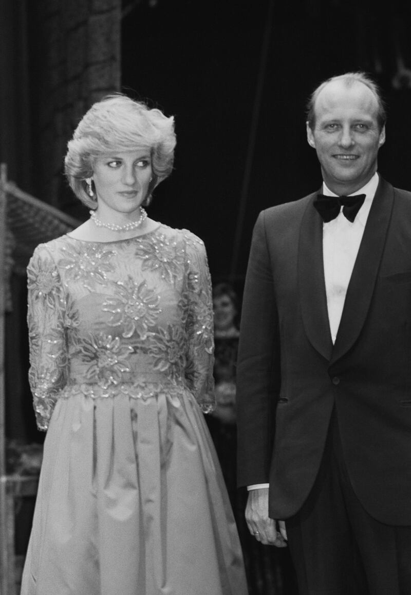 Diana, Princess of Wales (1961 - 1997) with Crown Prince Harald of Norway at a performance by the London City Ballet in Oslo, Norway, 13th February 1984. She is wearing a red evening gown by Jan van Velden. (Photo by Smith/Daily Express/Hulton Archive/Getty Images)