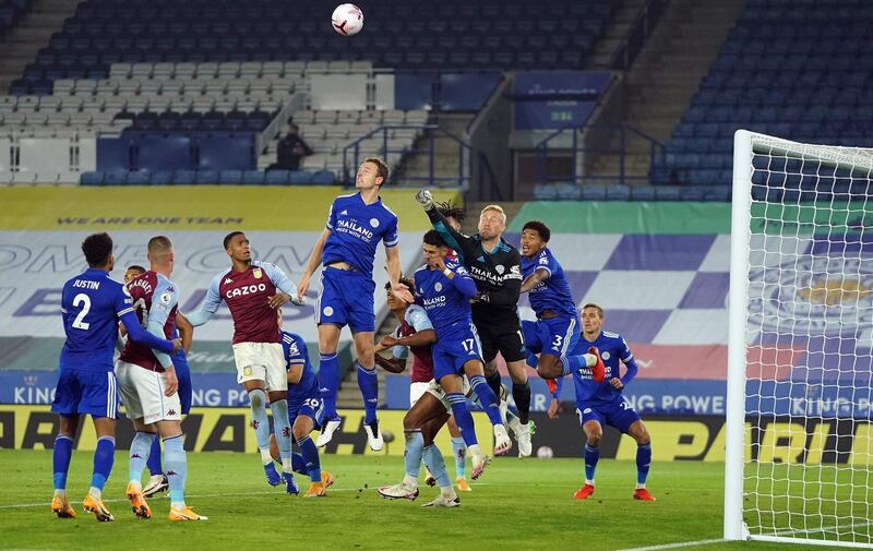 Leicester City's Danish goalkeeper Kasper Schmeichel punches the ball away. AFP
