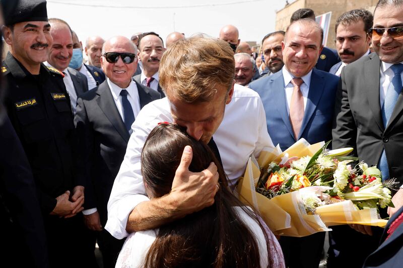 French President Emmanuel Macron is welcomed upon his arrival at the Al-Nuri Mosque in Iraq's second city of Mosul. AFP