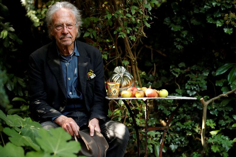 FILE PHOTO: Austrian author Peter Handke poses in his garden, following the announcement he won the 2019 Nobel Prize in Literature, in Chaville, near Paris, France October 10, 2019. REUTERS/Christian Hartmann/File Photo